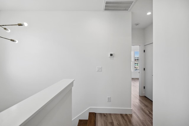 hallway with wood-type flooring