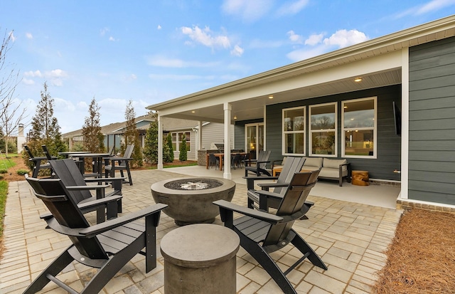 view of patio / terrace featuring an outdoor fire pit