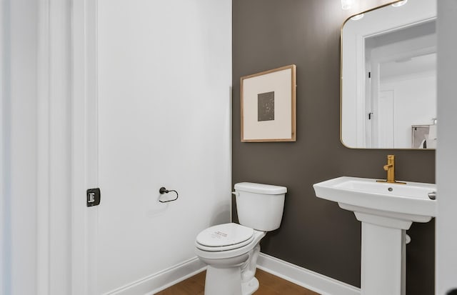 bathroom with toilet and sink