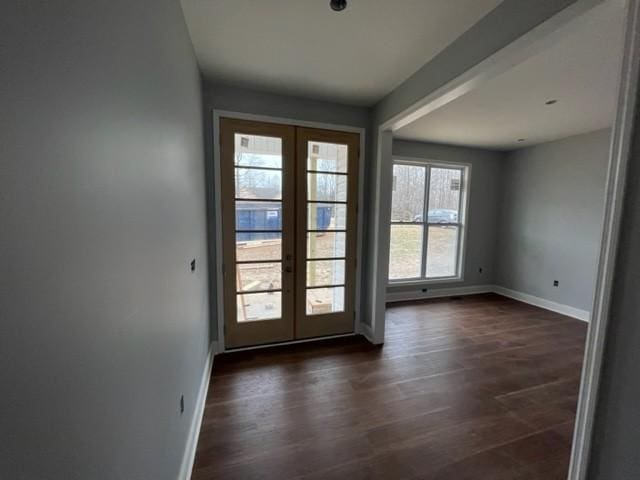 doorway to outside featuring french doors and dark hardwood / wood-style floors