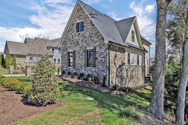 view of side of property featuring a yard