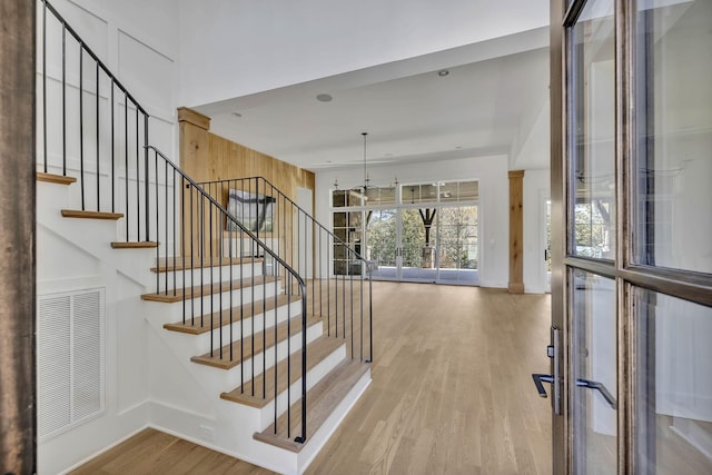 staircase with wood-type flooring