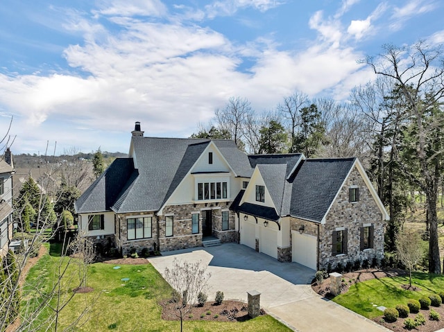 view of front facade with a garage and a front lawn