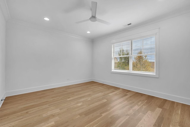 unfurnished room with crown molding, ceiling fan, and light hardwood / wood-style flooring