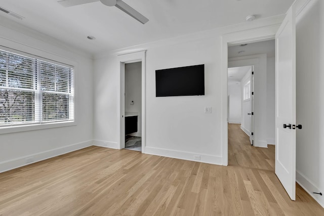 unfurnished bedroom with ornamental molding, ensuite bathroom, ceiling fan, and light wood-type flooring