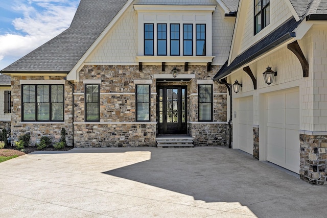 doorway to property with a garage