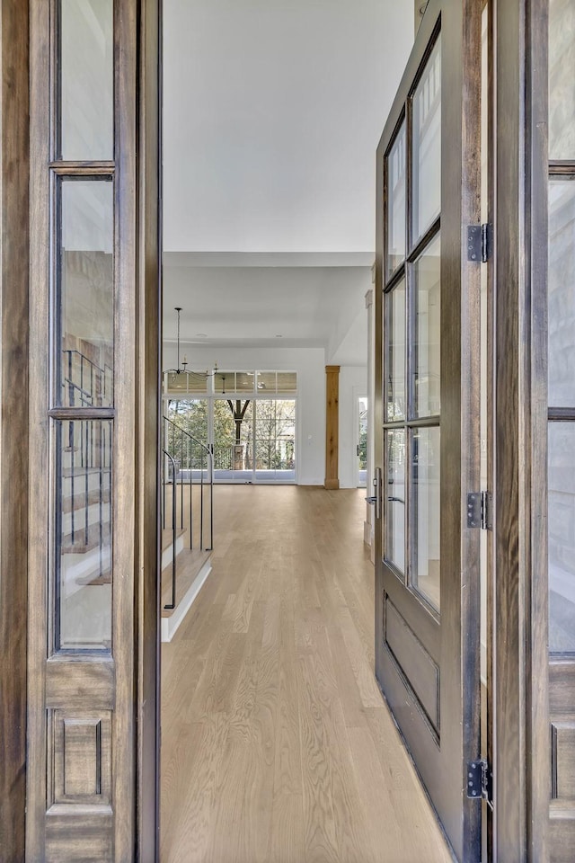 corridor with light wood-type flooring