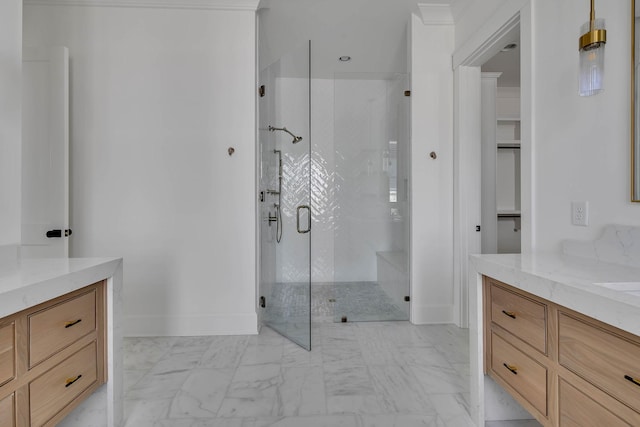 bathroom featuring vanity and a shower with door