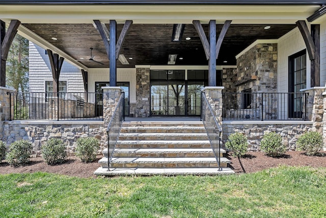 view of exterior entry featuring ceiling fan