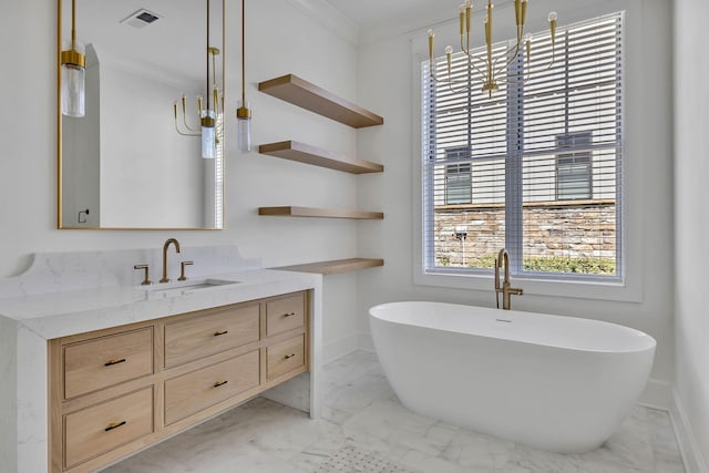 bathroom with ornamental molding, a bathing tub, and vanity