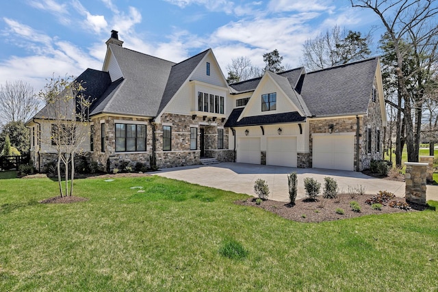 view of front of house with a garage and a front lawn