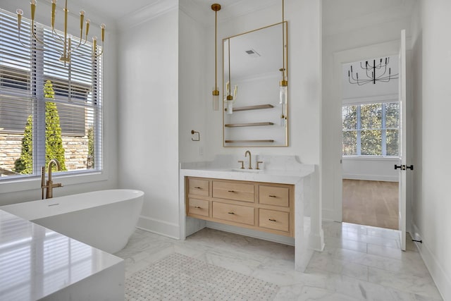 bathroom with ornamental molding, a tub, and vanity