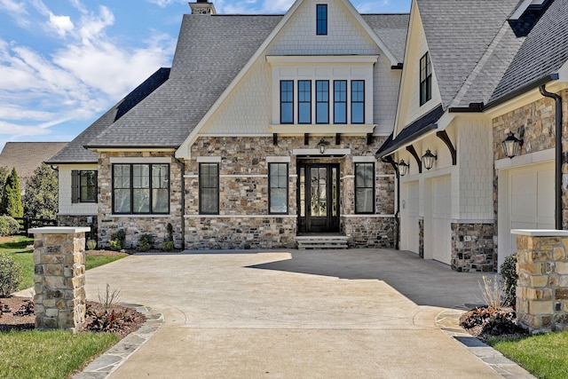 doorway to property with a garage and french doors