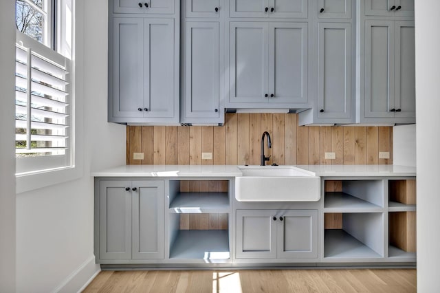 kitchen with sink and gray cabinetry