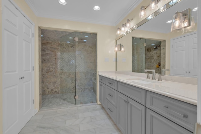 bathroom featuring an enclosed shower, vanity, and ornamental molding