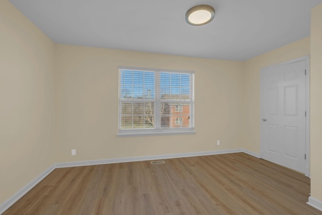 unfurnished room with light hardwood / wood-style flooring