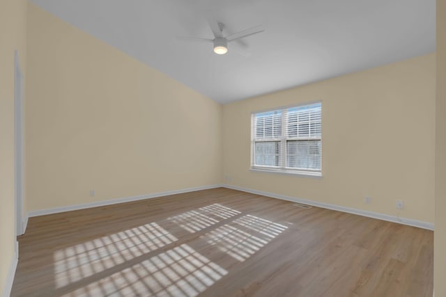 empty room with ceiling fan and light wood-type flooring