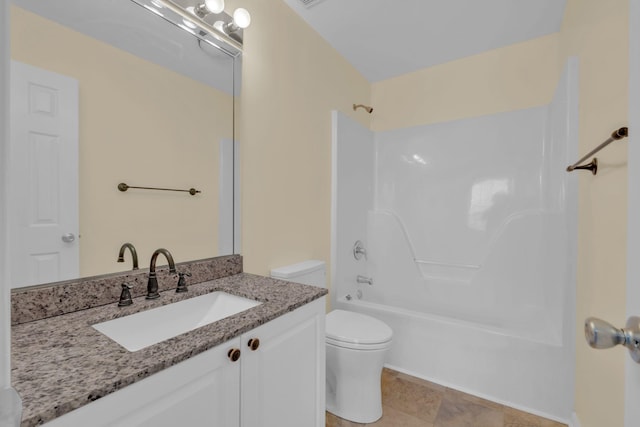 full bathroom featuring vanity, washtub / shower combination, and toilet