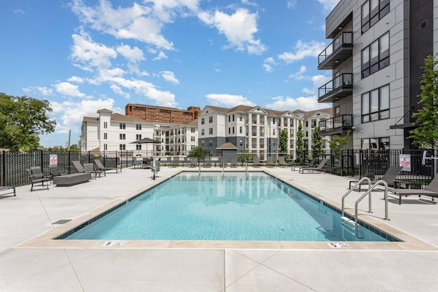 view of swimming pool featuring a patio area