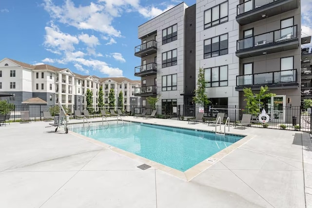 view of swimming pool with a patio