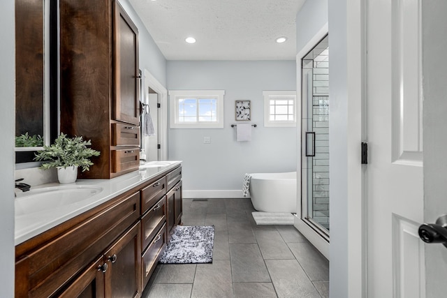 bathroom with shower with separate bathtub, a baseboard radiator, tile patterned flooring, vanity, and a textured ceiling