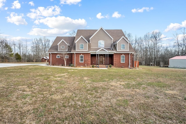 view of front property featuring a porch and a front yard