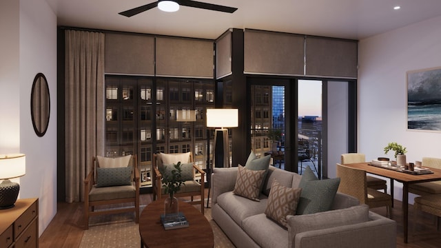 living room featuring hardwood / wood-style flooring, ceiling fan, and expansive windows