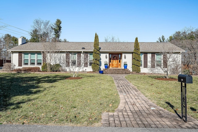 ranch-style house featuring a front lawn