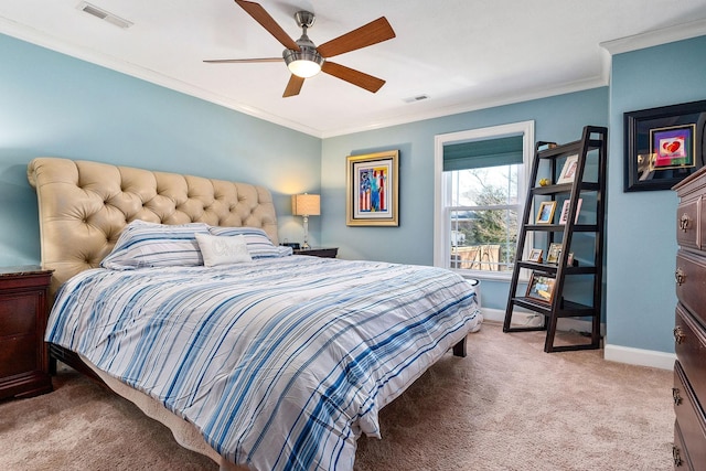 carpeted bedroom featuring crown molding and ceiling fan