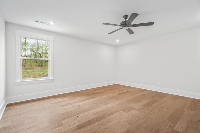 empty room featuring ceiling fan and light wood-type flooring