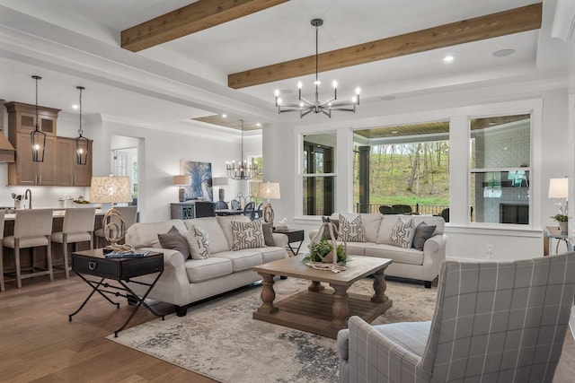 living room featuring light wood-type flooring and an inviting chandelier