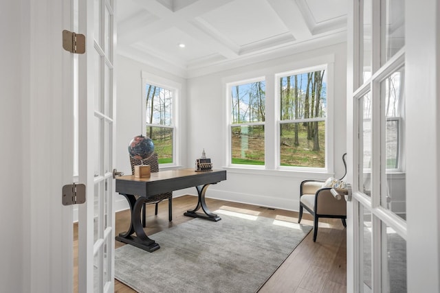 office with coffered ceiling, beamed ceiling, french doors, and a healthy amount of sunlight