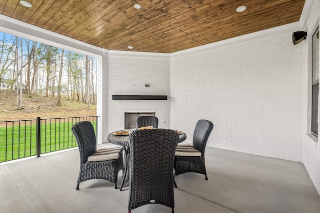 view of patio / terrace with an outdoor brick fireplace