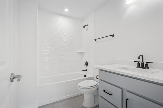 full bathroom featuring vanity, tub / shower combination, and toilet