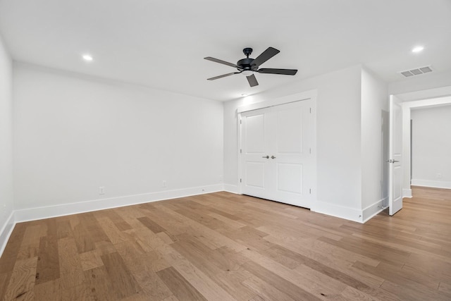 spare room featuring ceiling fan and light hardwood / wood-style floors