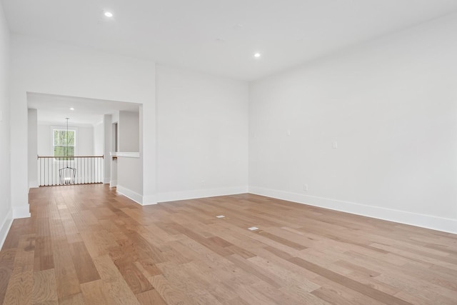 spare room featuring light hardwood / wood-style flooring