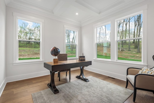 office area with a healthy amount of sunlight, coffered ceiling, and beam ceiling