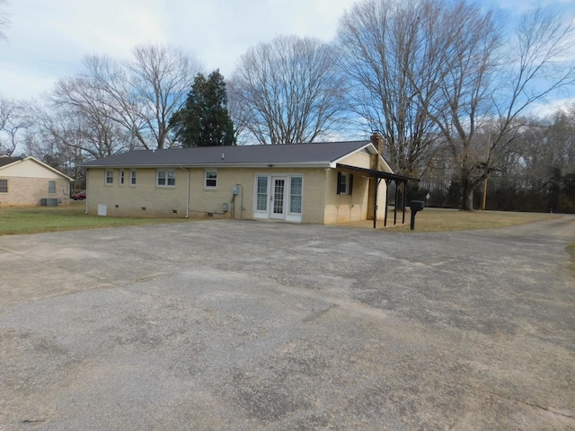 back of house featuring french doors