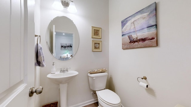 bathroom featuring sink and toilet