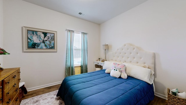 bedroom featuring dark wood-type flooring