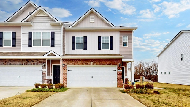 view of front of property with a garage and a front lawn