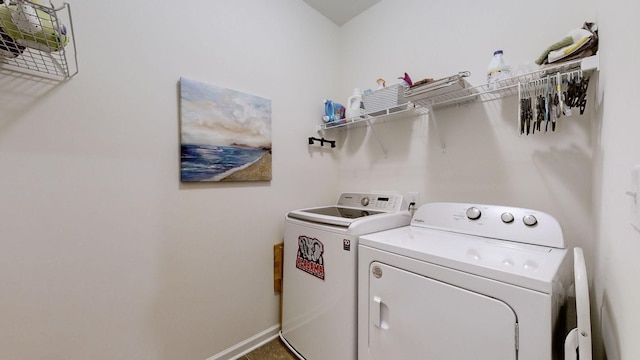 washroom featuring washing machine and clothes dryer