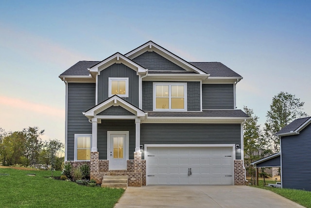 craftsman house featuring a garage and a lawn