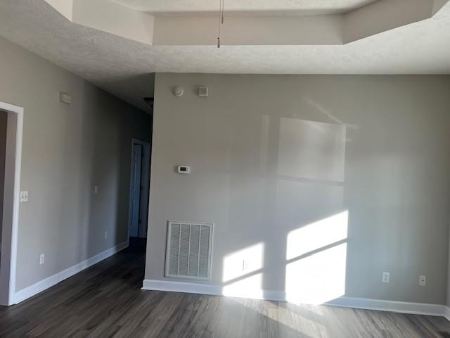 unfurnished room featuring dark hardwood / wood-style flooring