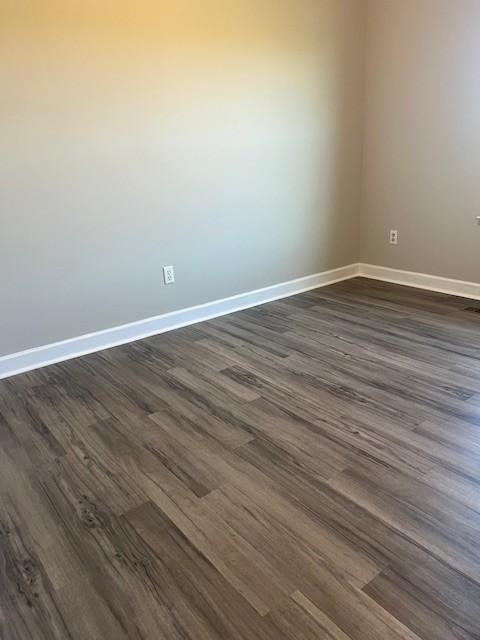 empty room featuring dark hardwood / wood-style floors