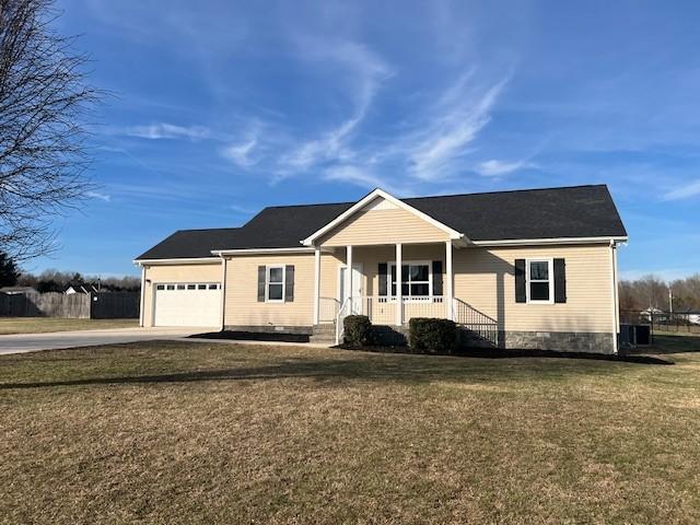 single story home featuring a garage, central AC unit, covered porch, and a front lawn