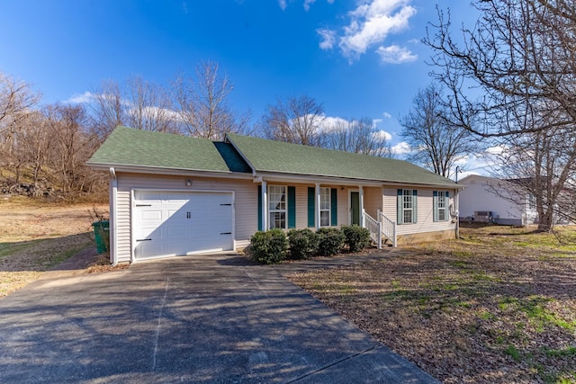 ranch-style home featuring a garage