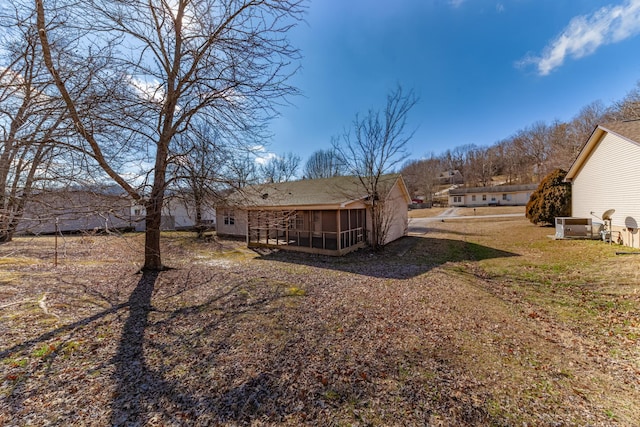 view of yard with a sunroom