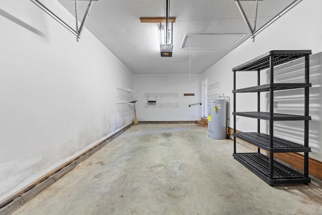 garage with a garage door opener and electric water heater