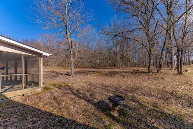 view of yard with a sunroom